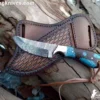 Hand-forged Cowboys knife with Damascus steel twist pattern blade and hybrid rosewood resin handle.