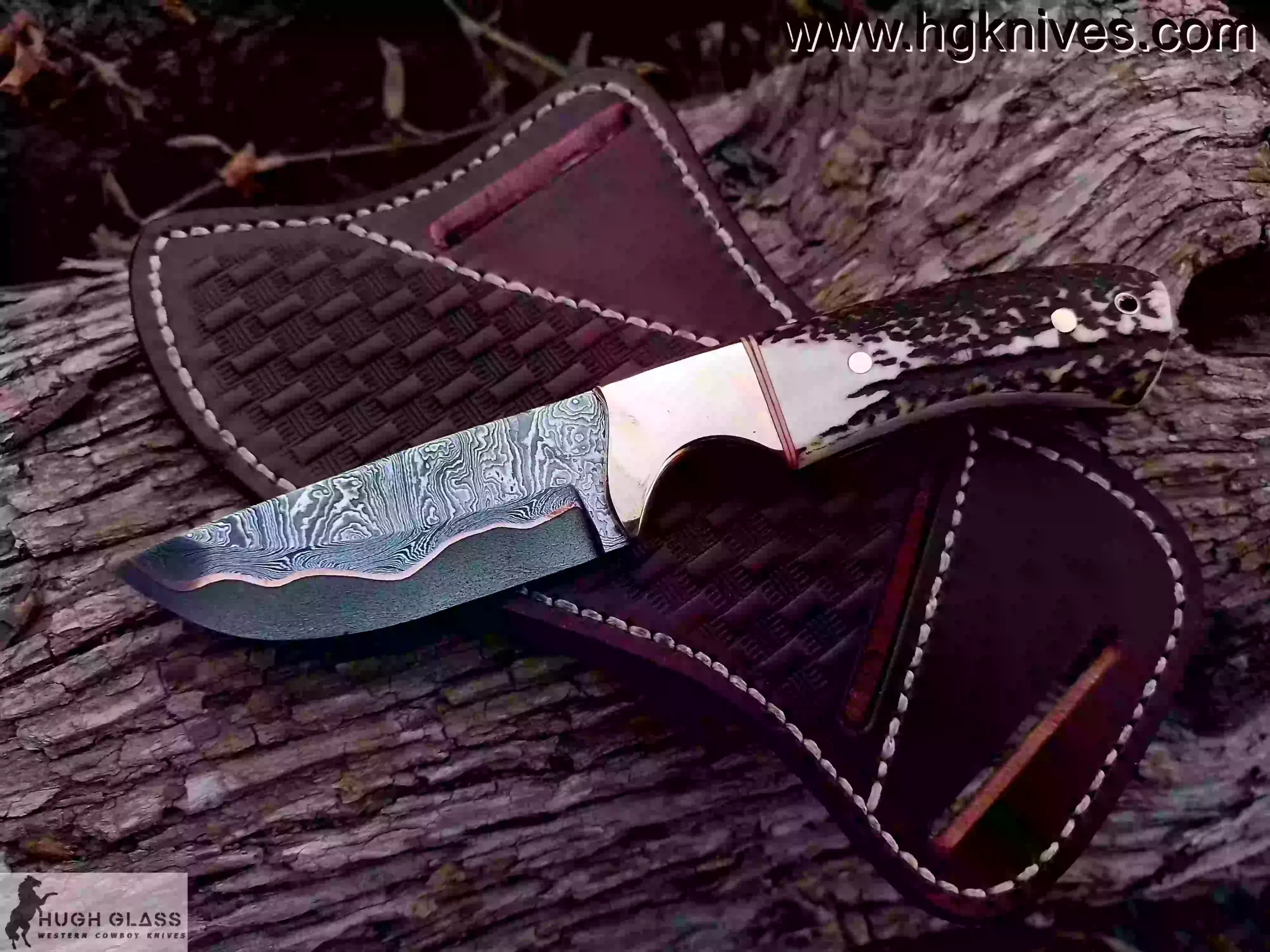 Detail of 512-layer hand-forged Copper Damascus hunting knife blade showing copper infusion and 60 HRC edge.