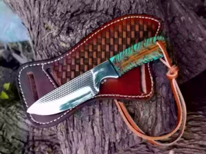 Custom Cowboy Knife with hand-forged Damascus steel blade and unique Pine Cone handle, shown next to the Pancake style cross-draw leather sheath.